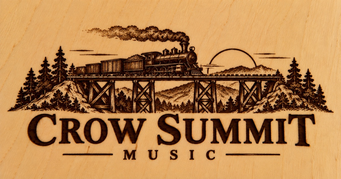 Crow Summit Music steam train crossing a mountain trestle